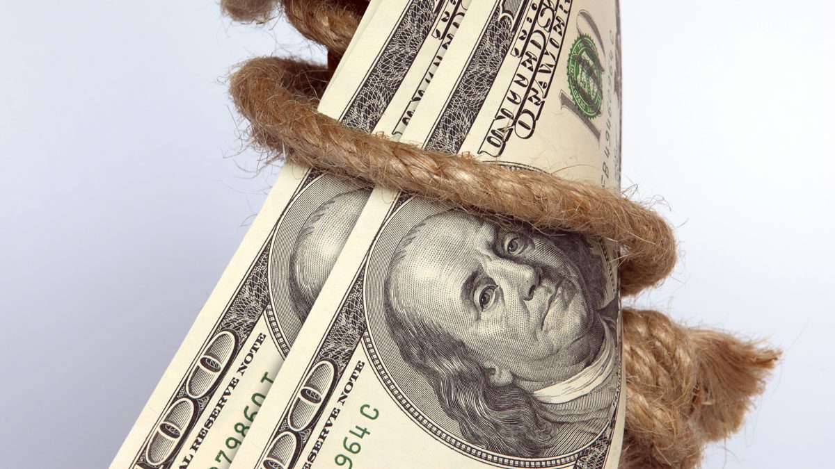 Stock photo of hundred dollar bills tied with rope